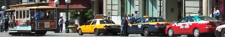 Cabs, drivers and cable car in front of the San Francis Hotel on Union Square