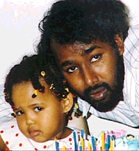 Photo of Hassan Mohamoud Yusuf and his young daughter
