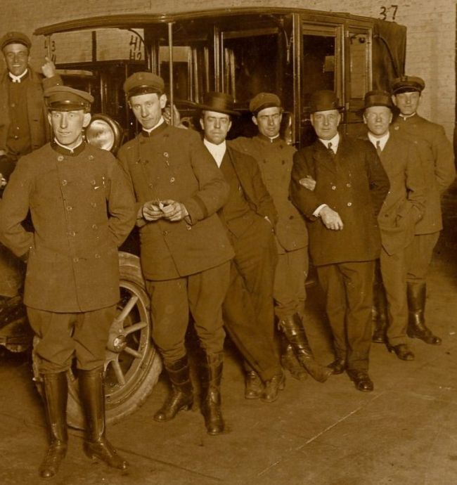 Photo of drivers in a cab garage